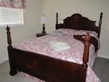 Queen four poster by Ashley with comforter sets never used