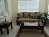 Rattan sofa, new, coffee table and end table to match