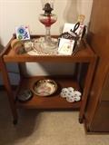 Wooden kitchen cart, dishes, oil lamp
