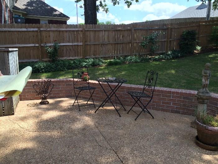 small round patio set with 2 chairs
