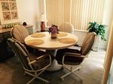 Kitchen table with Leather rolling chairs