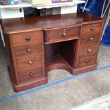 Late 1800's desk with carved screw knobs.
