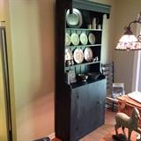 Primitive style handcrafted hutch. Pewter coffee service. pewter bowls, cream and sugar sets, red transferware china. Ladder back rush seat side chair.