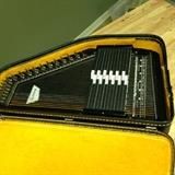 Vintage Oscar Schmidt Autoharp with case. In excellent condition.