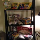 Games, puzzles, new boxes of crayons, other school supplies, stationary, greeting cards, too many items to list.