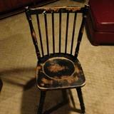 Very sturdy black distressed chair.
