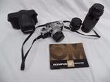 Olympus OM-1 with Case and Lenses www.CTOnlineAuctions.com/SandhillsNC