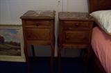 Pair of French commodes with marble tops.
