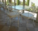 Wrough iron patio table and chair set.