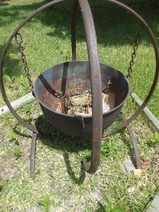 Witches pot in wagon rim holder
