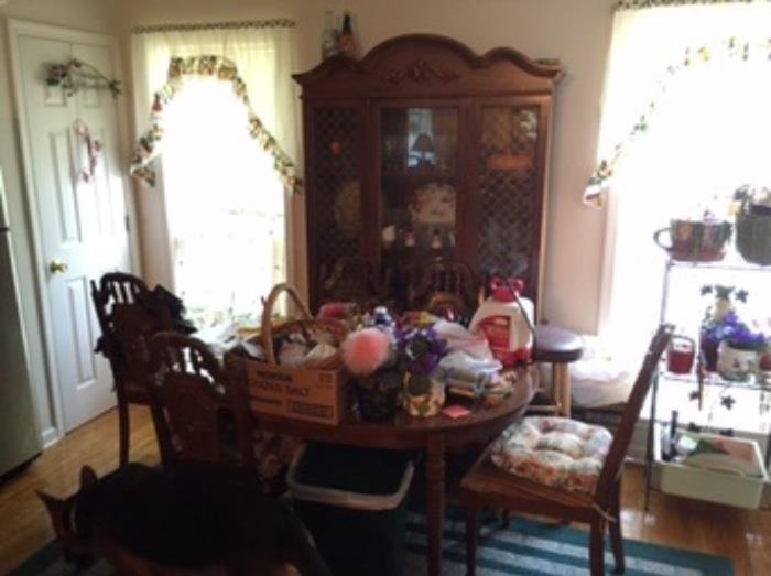 old dining set. china cabinet is full of old glasses and knick knacks. This part of the home was occupied by a lady that's turning 100 this year. No telling what you will find!