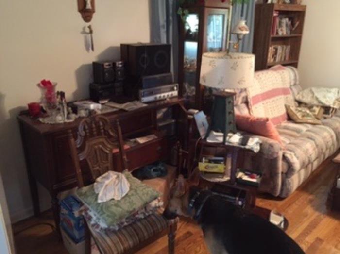 Couch, record player, speakers, glass display case FULL of knick knacks, tons of books, bookshelves
