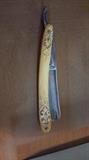 antique straight razor with box and sharpening stone
