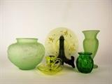 Item Description: A wonderful collection of five vintage Vaseline glass items including a yellow tone candleholder, a large vase with embossed floral motif in a soft light green tone, a fluted vase in green tone, an emerald green perfume bottle and a iridescent plate in a yellow tone boasting pink flowers.
