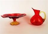 Item Description: Two gorgeous Amberina art glass items including a pitcher with a blown glass spout and a pedestal dish with wide fluted rim.
