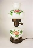 Item Description: A charming vintage milk glass Gone with the Wind style hurricane lamp with hand painted floral design a key style switch.
