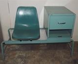 Item Description: A retro blue medical style plastic seat with attached metal drawer.
