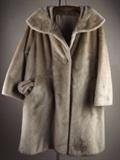 Item Description: A beautiful vintage ladies' faux fur coat in a light brown color with matching hat, the label reads: BRAZOTTA A LUXURIOUS FABRIC BY COLLINS & AIKMAN STYLED BY FAIRMOOR CLEAN BY FUR COAT METHOD DO NOT BRUSH PRESS OR STEAM. 
