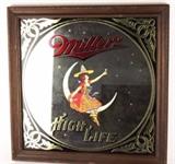 Item Description: A retro 1979 Miller High Life Beer framed mirrored sign showing a lady sitting on the moon with a beer in her hand toasting the stars around her.
