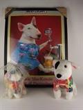 Item Description: A fun group of Spuds MacKenzie like items including a framed Spuds MacKenzie Dean of Partyology poster and two stuffed Spuds look alike dogs wearing Hawaiian shits
