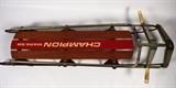 Item Description: A lovely retro Champion Mark 56 double snow sled comprised of wood with painted red metal runners.
