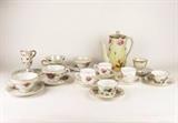 Item Description: A lovely assortment of vintage hand painted tea cups and saucers with makers marks such as Royal Stuart, Lefton, and Sterling along with a beautiful Nippon floral patterned tea pot with gilded accents.
