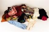 Item Description: A gorgeous assortment of over forty ladies vintage scarves and over twenty five pairs of gloves including a pair of cream colored Grandoe soap able leather long gloves in a size 6.5, a pair of burgundy Isotoners, several pairs of dress gloves and much more
