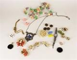 Item Description: A stunning collection of vintage costume jewelry and buttons, including a lovely pastel colored necklace marked west Germany, a cameo broach, a stainless steel watch, several pairs of clip on earrings and much more.
