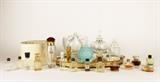 Item Description: A glamorous assortment of vintage ladies items including a collection of perfume bottles, including several small filled bottles of perfume with names like Coco Chanel, Aimant Coty, Cordon D'Argent, along with many empty bottles, and a lovely mirrored vanity tray. 
