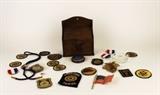 Item Description: A handsome rustic wooden box with metal eagle on front containing an assortment of vintage American Legion and U.S. Military memorabilia. Some favorites include several American Legion patches, a brass toned metal West Point pin, and a small American flag.
