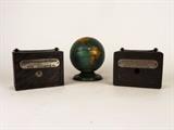 Item Description: A collection of retro metal banks, two reseble metal safes one isfrom the Newcastle Savings & Trust Company, the other is from Lawerance Savings & Trust Company, there is also a lithograph tin globe bank from the World Bank marked "Ohio Art Co. USA".
