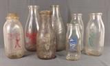 Item Description: A collection of rustic vintage glass milk bottles, some favorites include two marked "Risher's Dairy, Warren, O., another with 'Colteryahn Sanitary Dairy, 951 Banksville Rd'. on one side and PEP growing Children with Milk' with a picture of a boy playing with his dog, there is also one from Page's Pittsburgh Milk Co. that has a picture of singing birds with "The Sweetest Milk Ever Sold" written on one side, 
