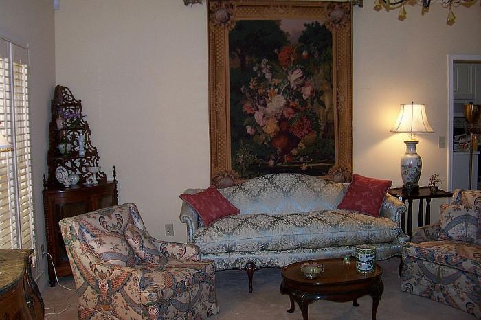 View of the living room featuring a beautiful chippendale sofa - pair of chairs; wonderful Victorian corner what know cabinet; also shown is a wonderful tapestry