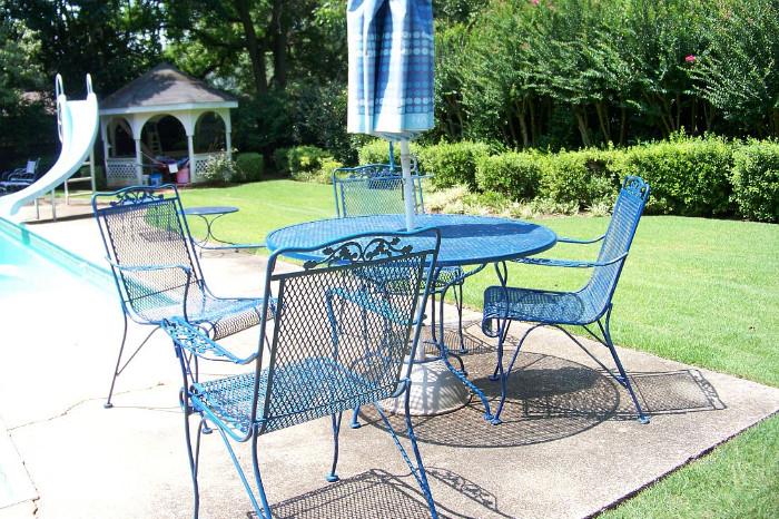 Iron patio table with four chairs