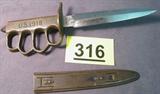 WWI Military Trench Knife with Sheath US 1918 Trench knife with brass knuckle style handle, comes with original sheath. Knife handle is marked "U.S. 1918", blade is marked AU Lion, sheath is marked L.F.& C 1918. Entire length of knife is 11.5".