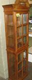 Furniture Wooden Display Cabinet Darling wooden display cabinet with light at top and glass windows and shelves. Measures 73" tall x 20" wide.