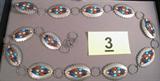 Jewelry Signed Sterling Silver Concho Belt w/ Gems Wonderfully crafted Sterling Silver linked belt with multiple colored stones on each concho style piece, signed "Mary Ann Spencer" on back. Stones are different shades of blues, pinks and reds; possibly Turquoise, Lapis, Coral, etc (?). Measures 39" in total length.
Total Weight: 264.3 grams / 8.500 ozt