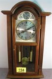 Furniture Wooden Key Wind Wall Clock Wooden key wind wall clock with pendulum and 31 day chime.
Parliament is written on clock face, also above the face the Latin words: "Tempus Fugit" meaning "Time Flies". Clock appears to be in working order, measures: 27" tall.