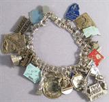 Jewelry Vintage Sterling Silver Charm Bracelet Sterling Silver linked chain bracelet with concealed box clasp, has various collectible souvenir charms (states, pennants, etc). All except 2 are made and marked 'Sterling'; Statue of Liberty & "Two Guns" pendant charms.
Total Weight: 85.4 grams