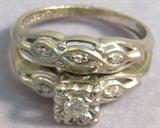 Jewelry, 14kt Gold & Diamond Wedding Ring Set Stunning, vintage 14kt white gold wedding ring set with diamonds. Band has small diamonds and a hook to attach both rings together, size: 5.
Engagement ring has one large diamond and 2 small diamonds, size: 6.5.
Total weight: 2.5 dwt.