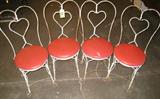 Furniture Set of 4 Cast Iron Patio / Parlor Chairs Set of 4 ice cream parlor / side chairs with Cast Iron heart design on back, red upholstered seat. Great vintage set, would make a great fixer-upper project! Some rust and usual signs of wear due to age, each measure 35.5" height x 15.75" width x 15" seat diameter.