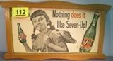Vintage 7-Up Advertising Sign in Wooden Frame Vintage 7-Up soda advertisement sign in wooden frame from 1955. Sign reads "After school nothing does it like Seven-Up!". Sign has a small tear that has been taped.
Measures: 13.5" tall x 25" wide.