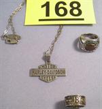 Jewelry Lot of Sterling Harley Davidson Jewelry Sterling silver jewelry with Harley-Davidson motorcycle logos.
Necklace with Harley-Davidson logo pendant, measures: 12" long.
2 Rings with the Harley Davidson symbol, size: 6.5.
