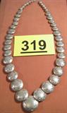 Jewelry Sterling Reversible Concho Style Necklace Vintage hand crafted Sterling Silver necklace with reversible concho style beads, hook clasp with small piece signed "LH". Measures 23.25" in length.
Total Weight: 88.7 grams / 2.850 ozt