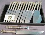 Lot of Gorham "Chantilly" Sterling Silver Flatware Great partial set of Sterling Silver knives and serving pieces in the "Chantilly" pattern made by Gorham Sterling. Includes:
12 Hollow Handled Dinner Knives with stainless steel blades, measure 9.5" length.
Carving Knife w/ scratches on stainless steel blade, measures 13" length.
Meat Carving Fork, measures 10.75" length.
Cake / Pie Server, measures 9.5" length.
Hot Cake Server, measures 9.75" length.
Total Weight: 47.38 oz / 43.195 ozt