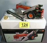 Farm Toy Ertl Allis Chalmers "D-17" Tractor 1/16 scale die cast model / replica toy tractor. Precision Series 8, "The Allis-Chalmers "D-17" Tractor with New Idea Picker". Good condition but picker has some small damage and missing one of the side bars to help hold the piece in place. Box and medal are present, but no extra papers or pamphlets. Item was previously displayed in a smoke free home, appears to be in original factory box.