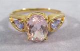 Jewelry, 14kt Yellow Gold Ring with Pink Gemstone Beautiful 14kt yellow gold ring with large oval shaped pink stone, possibly Quartz, and 2 small teardrop shaped purple stones, possibly Spinel.
Size: 7.25, total weight: 1.6 dwt.