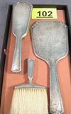 Whiting & Davis Sterling Silver Vanity Brush Set Vintage set of hand-held mirror, hair brush and clothes brush all made of Sterling Silver. Made and hallmarked by Whiting & Davis. Mirror and clothes brush are monogrammed "JDL", hair brush is monogrammed "MHD". Mirror measures 11.75" length x 5" width; Hair brush measures 9.5" length x 2.75" width; Clothes brush measures 6.25" length x 3.5" width.
