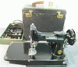 Antique 1934 Singer Featherweight Sewing Machine Singer Featherweight portable electric sewing machine in hard black carrying case. Also includes Singer Catalog 3-110 Sewing Motor, pedal / motor controller No. 194548, extra attachments, some spools of thread, and more! Case has edge wear and is a bit rough, motor has name "Veola" scratched into the side. Serial No. AD788004, according to website this machine was manufactured in 1934.