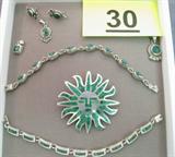 Jewelry Sterling Silver & Malachite Pieces Sterling silver jewelry with inlaid Malachite stones, some pieces marked Mexico.
Bracelet with teardrop shaped links, measures 7.5" long.
Bracelets with rectangle shaped links and mosaic style malachite stones, measures 7" long.
Large sun shaped pendant marked Mexico, measures 2.5" diameter.
Matching earrings and pendant set with oval shaped stones.
Square shaped pendant and round shaped pendant with rope design.
Total weight: 2.845 ozt.